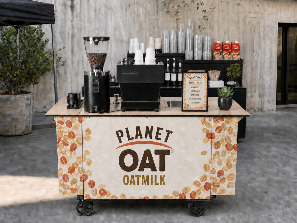 Mobile espresso cart wrapped in Planet Oat oatmilk branding