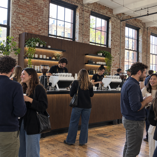 Baristas running a finished espresso bar build at an event