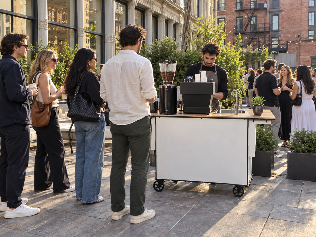Guests waiting at a branded mobile espresso bar at an outdoor brand activation