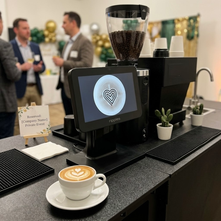 An ESOM espresso bar at a private corporate event, with a drink-top printer on the counter and a finished latte in the foreground